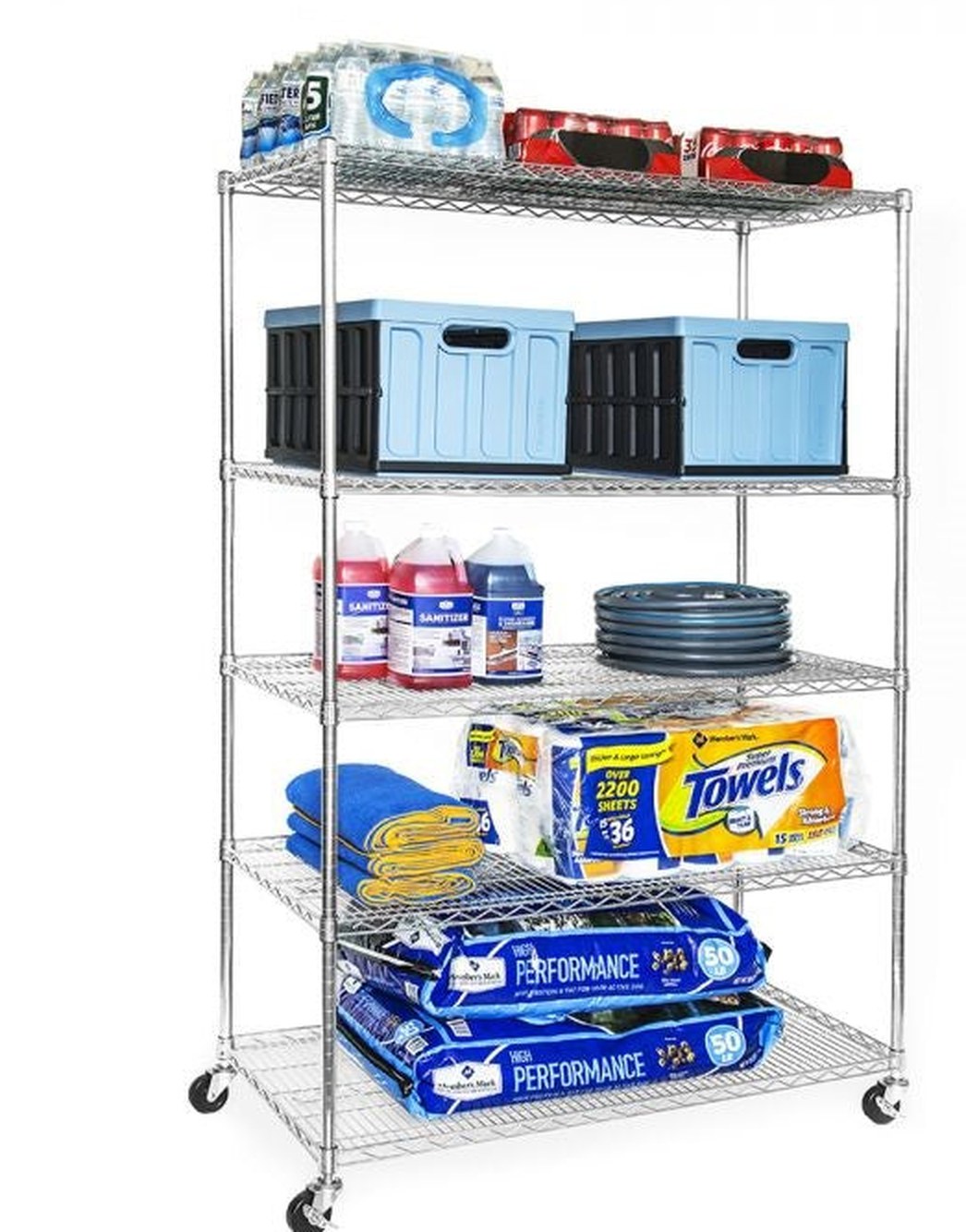 A Seville Classics UltraDurable five-tier chrome wire shelving unit on casters, loaded with crates, bottled water, sanitiser jugs, a coiled hose and bags of salt