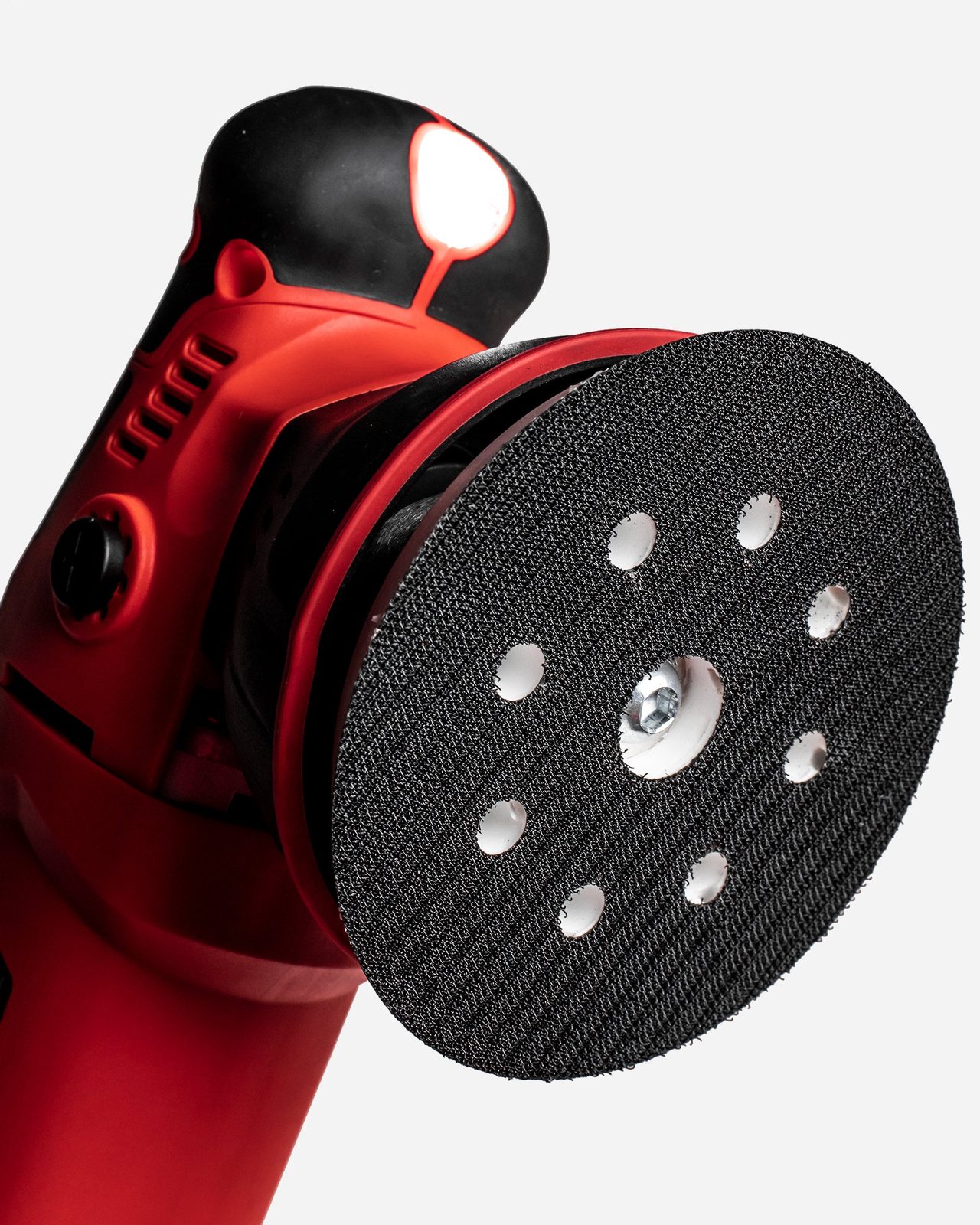 Close view of the backing plate on a dual-action car polisher