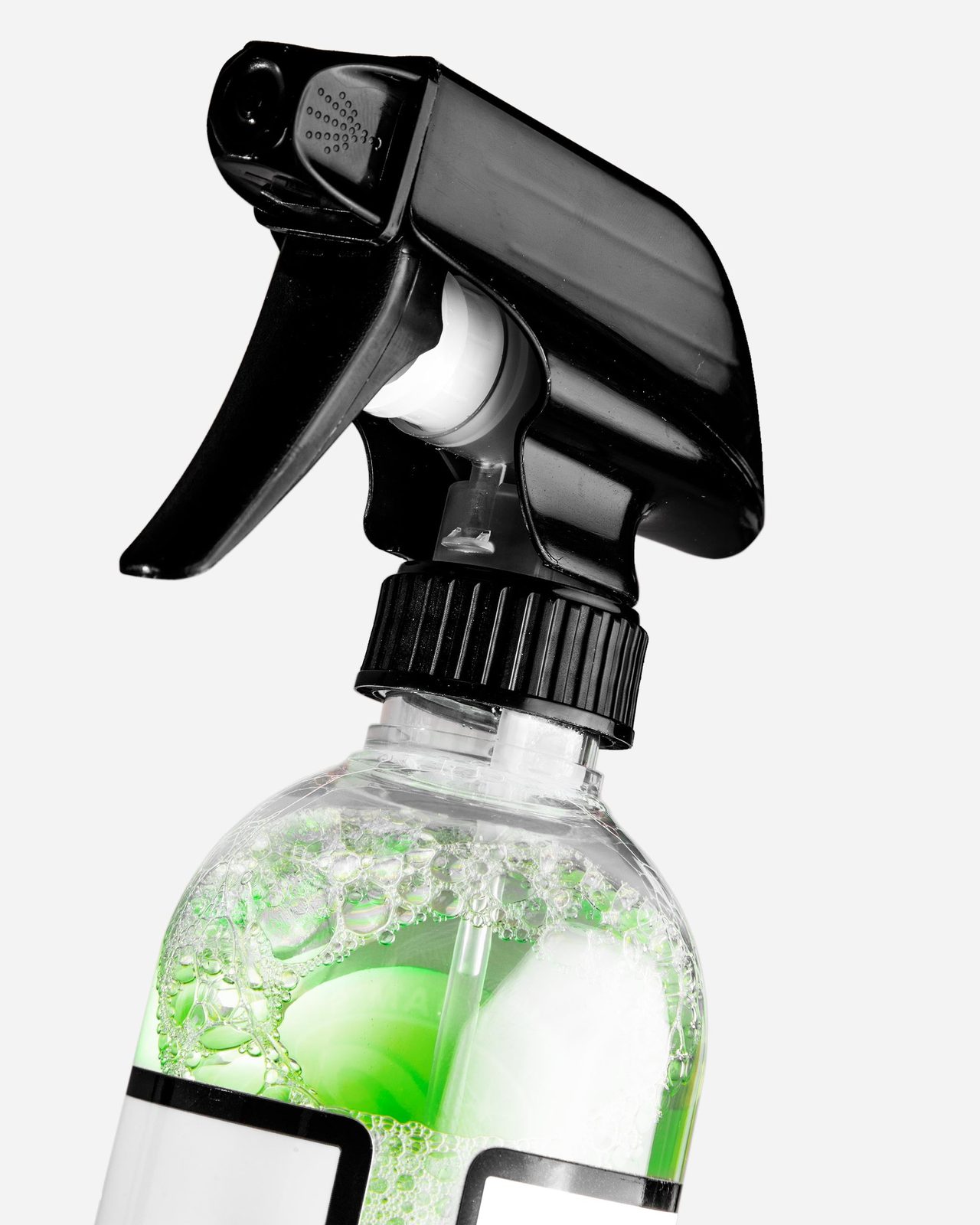 Close view of a trigger sprayer on a bottle of automotive glass cleaner